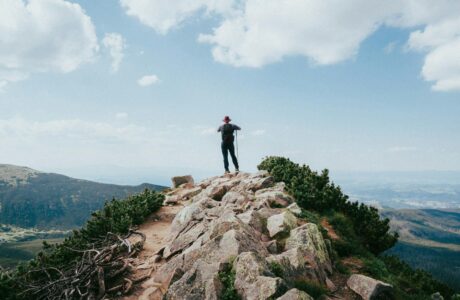 hiker on top of a rocky mountain